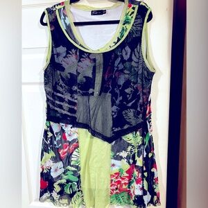 A colorful, floral sleeveless tunic top